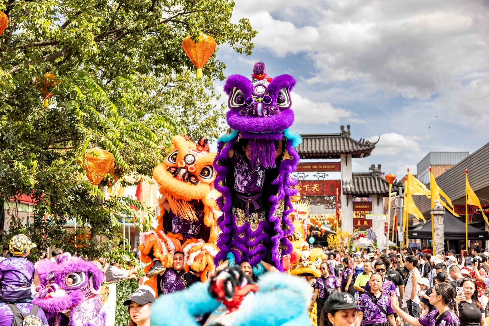 Lion dance in front of the Pai Lau gate