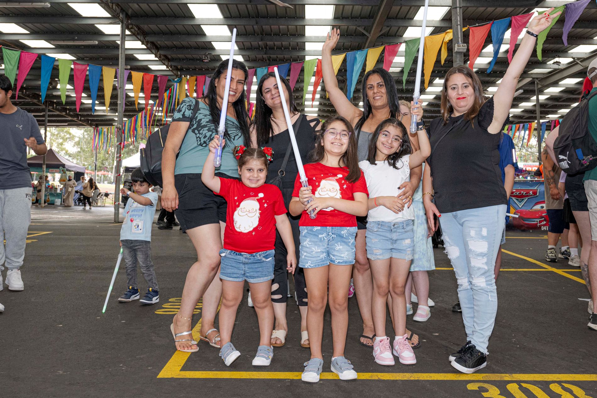 Family-with-lightsabres-at-Illuminate.jpg