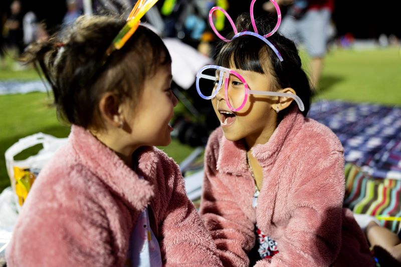 Sisters-with-glow-in-the-dark-glasses-at-Illuminate-2022