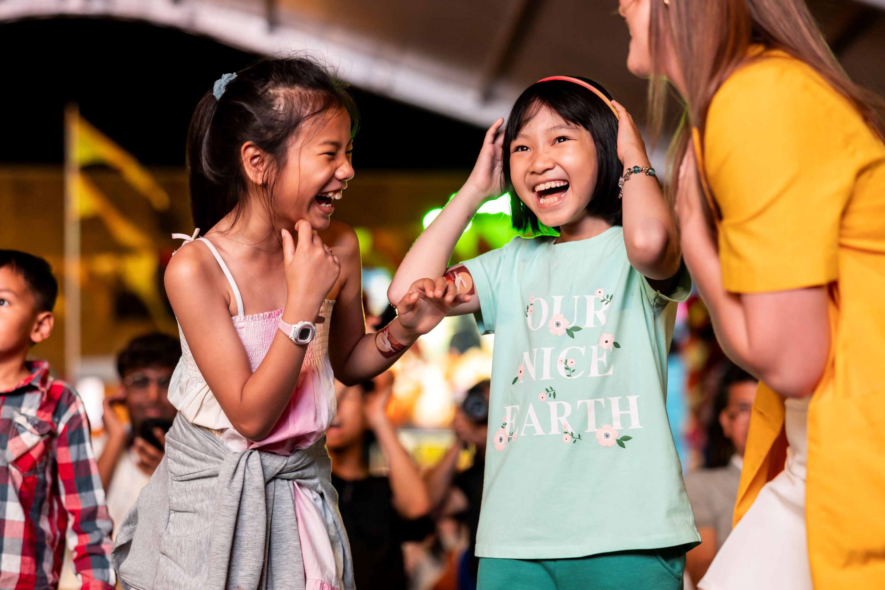 Kids laughing at Cabramatta Moon Festival 2023 by Ken Leanfore